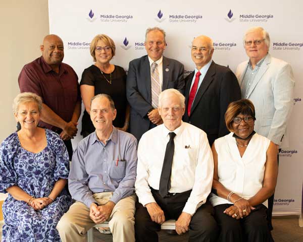 The retirees shown are, front row, L-R, Nancy Stroud, executive vice president of Finance & Operations; Dr. Earl Shinn, business professor; Joseph Garrison, associate professor of math; and Shirley Plummer, administrative coordinator, Department of Nursing. In the back row, L-R, are Fred Hill, utility specialist; Amy Hudnall, director of the Center of Innovation for Aerospace; Pedro Colon, lecturer for the Department of Information Technology; and Jerry Williams, senior lecturer for the Department of Management and Marketing. 